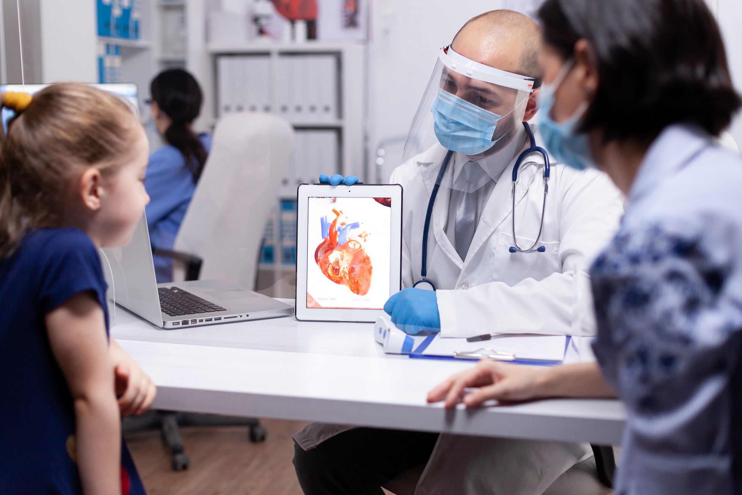 Pediatrician explaining heart condition