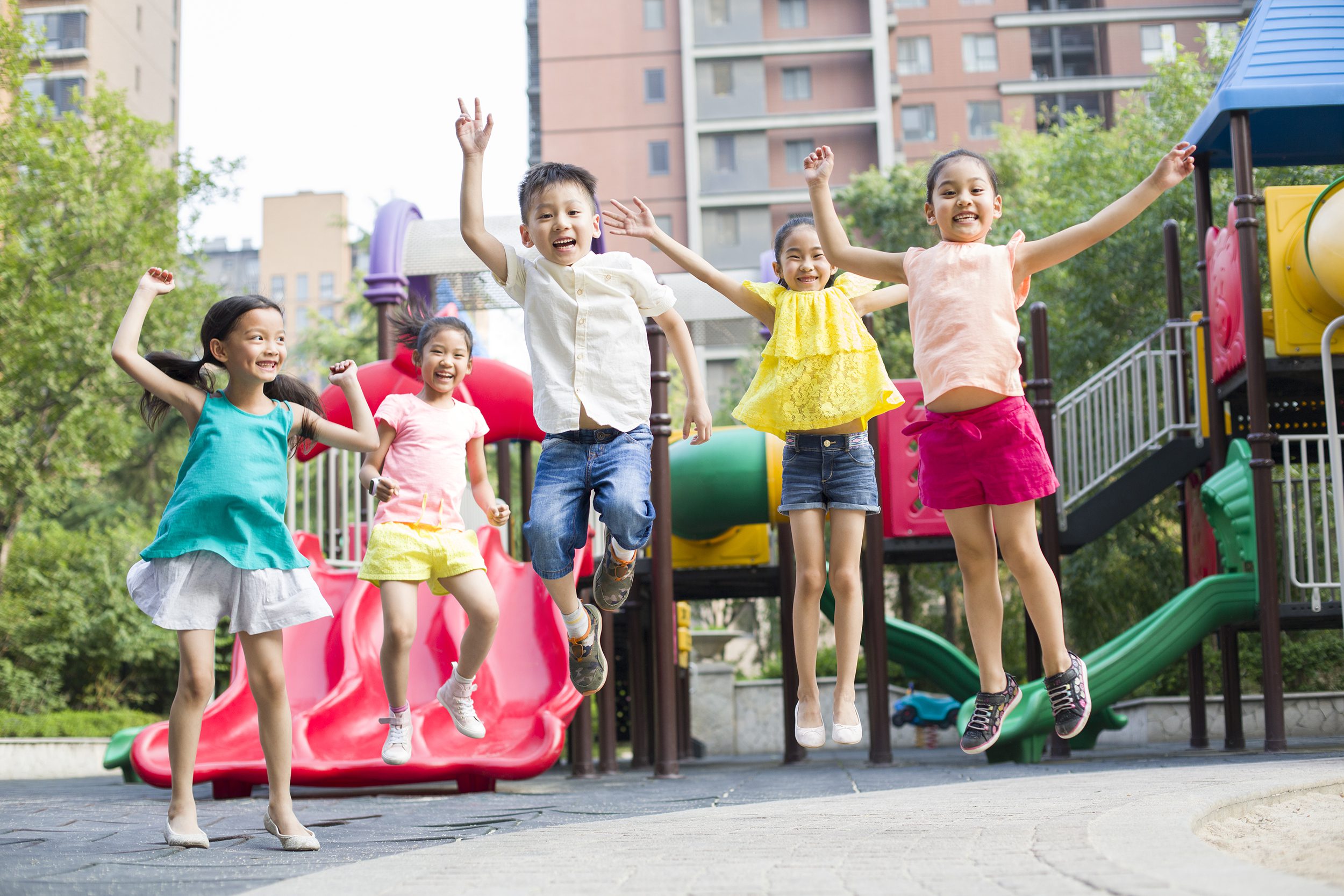 Happy Chinese children playing in park