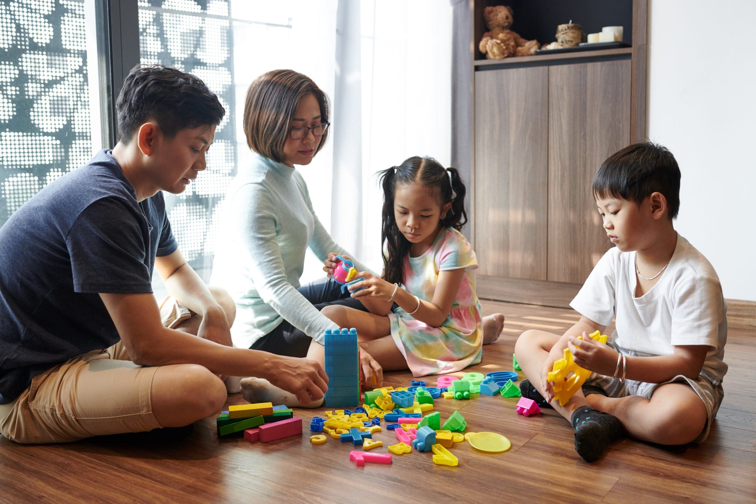 Parents and children playing together